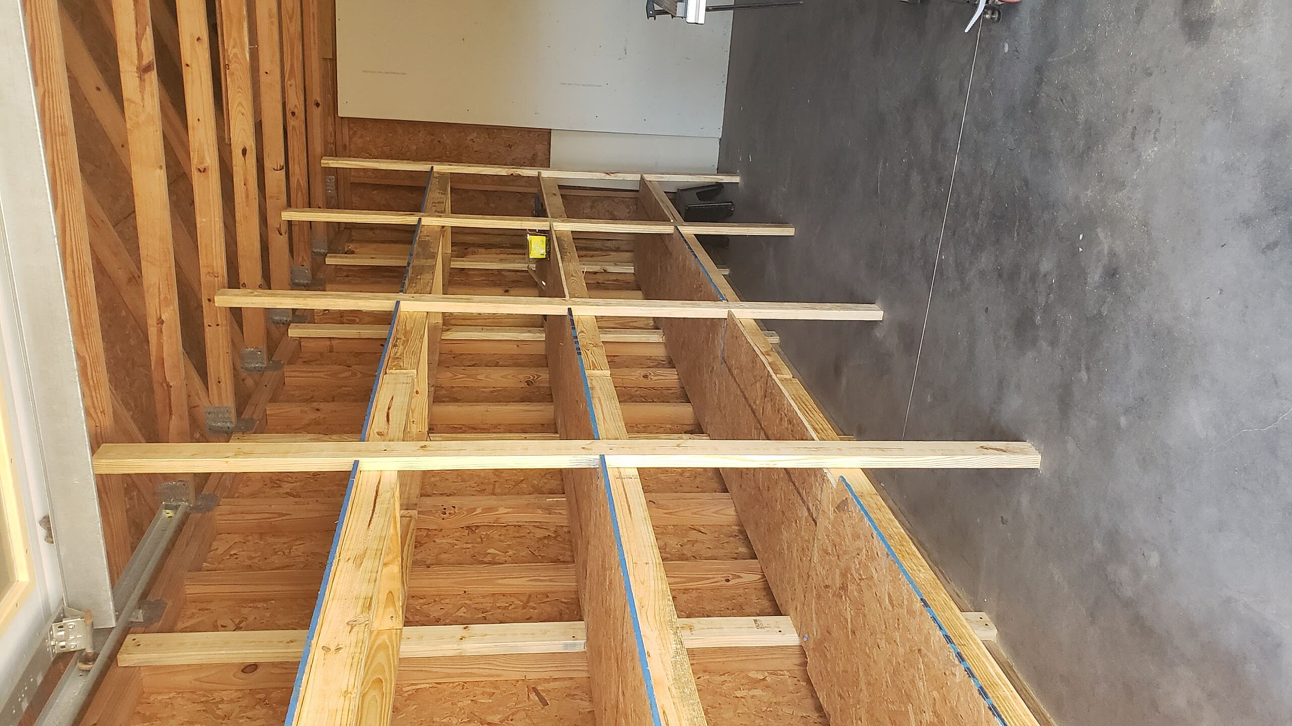 Fitting heavy duty storage planks to garage wall anchors