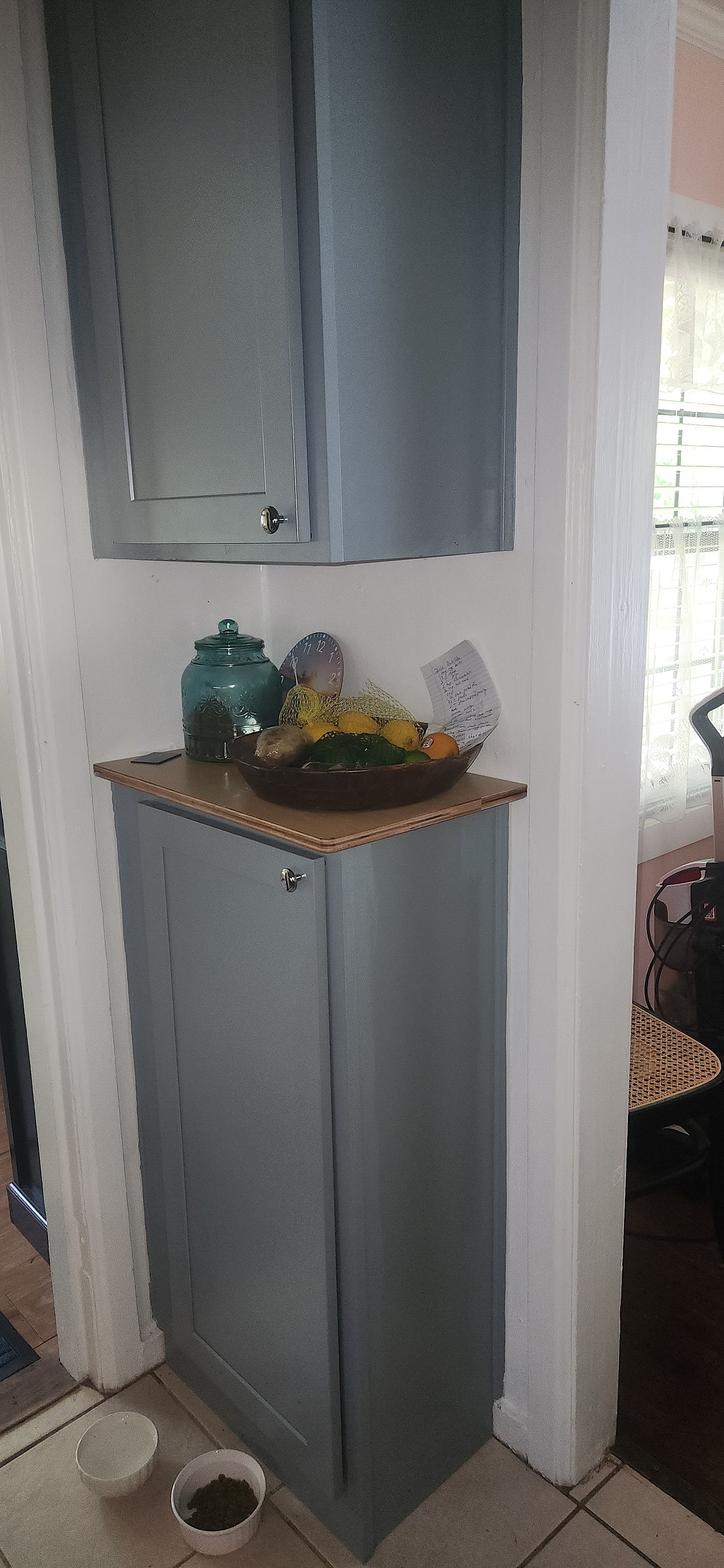 Updated kitchen trim, sink area, and wall finishes in classic home remodel