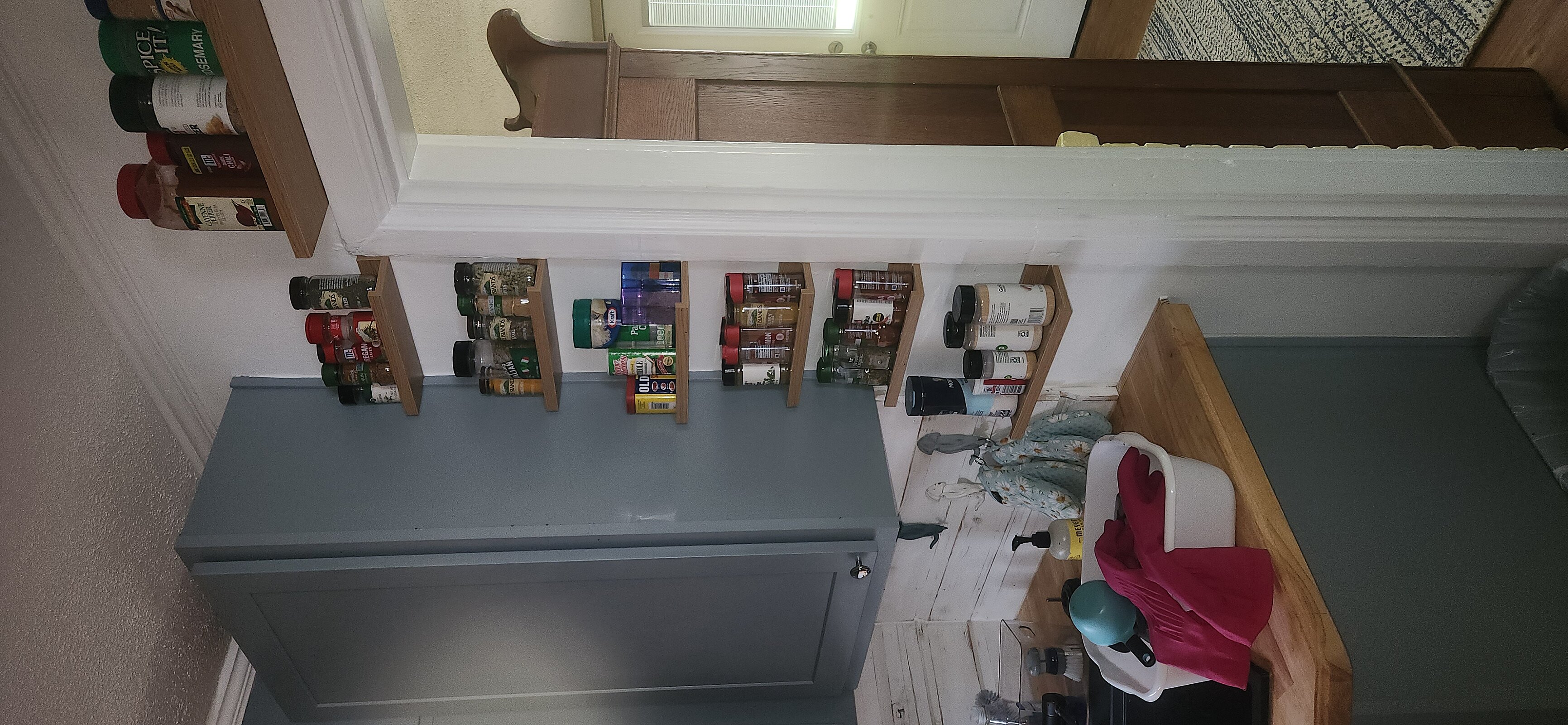 Clean backsplash and aligned cabinet doors in finished 1942 kitchen restoration