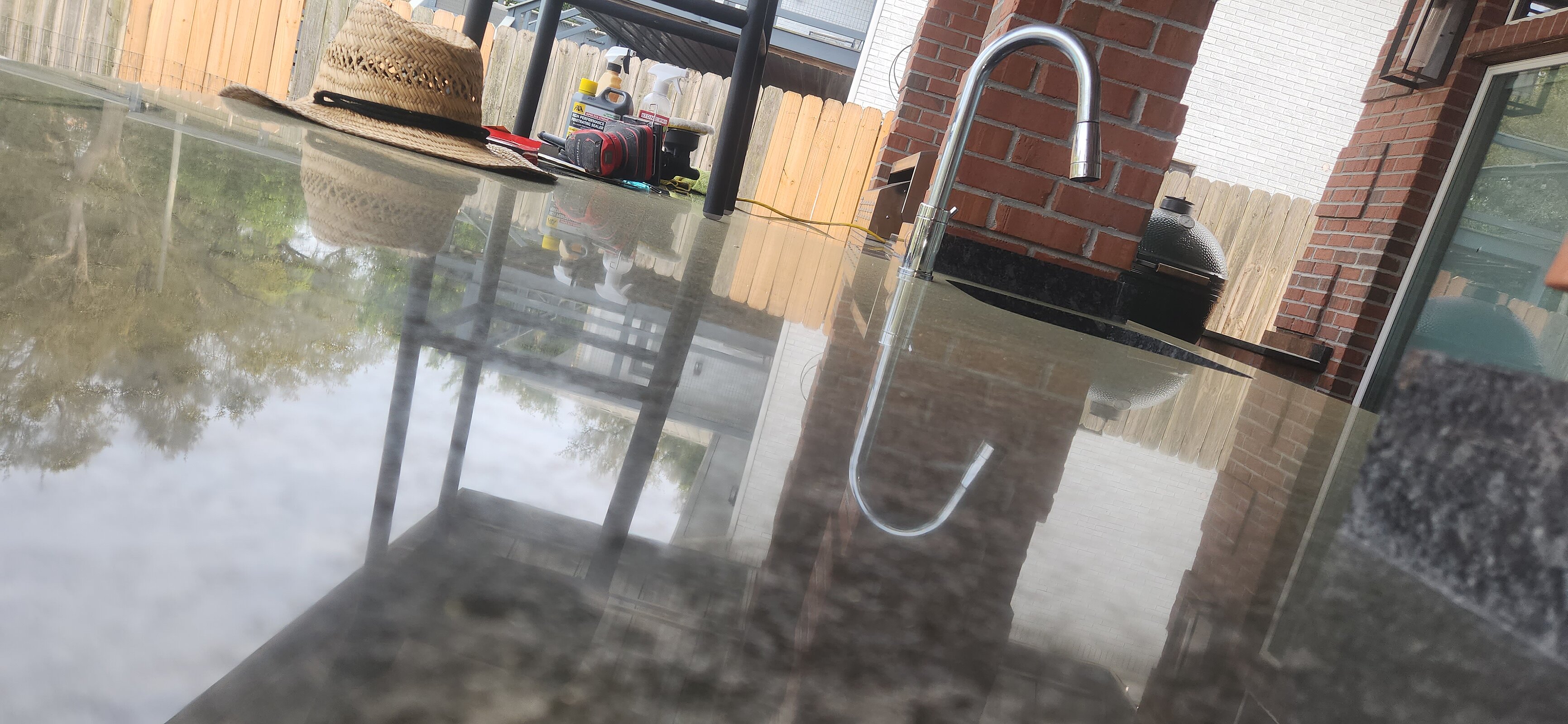 Refinished patio kitchen counter showing vibrant stone color revival