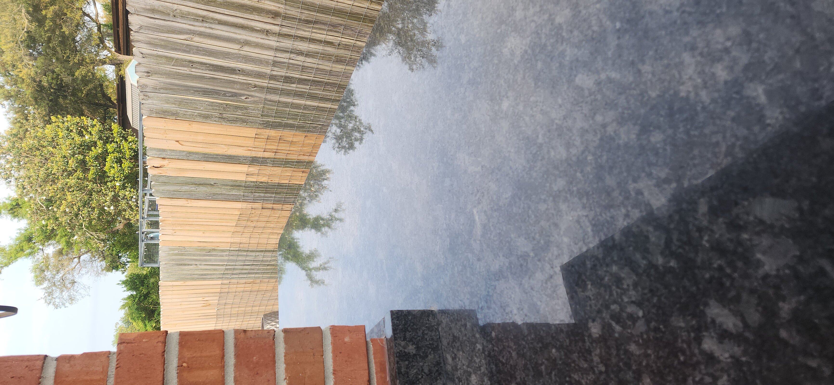 Water-repellent protective seal coat applied to outdoor stone surface