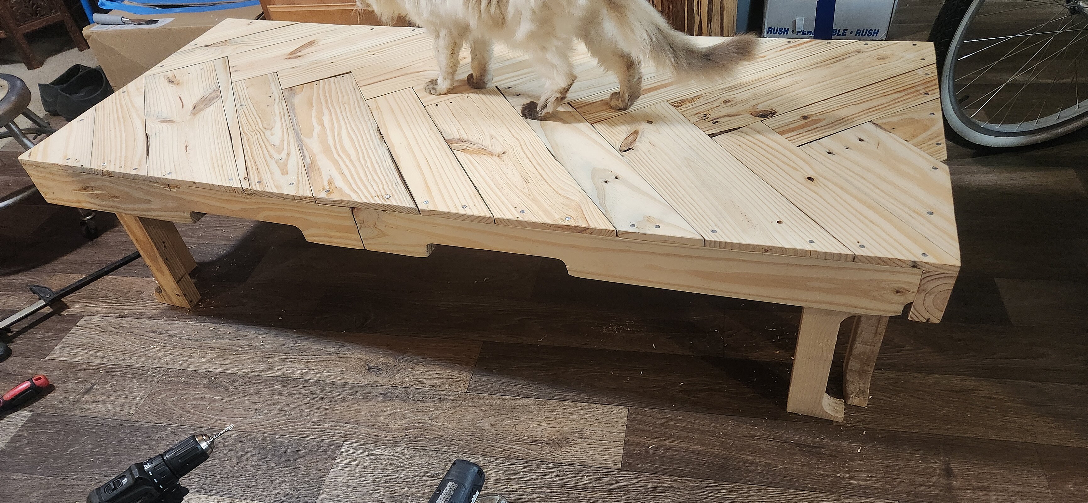 Gluing and securing individual wood pieces to table base frame